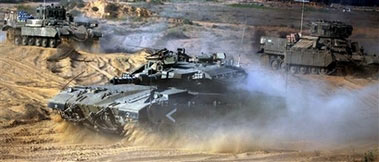 An Israeli military tank and armored vehicles advance towards the abandoned airport near the southern Gaza Strip town of Rafah from a gathering point near kibbutz Kerem Shalom, just outside the Gaza Strip, Sunday, July 9, 2006. Israel will push forward with its offensive in the Gaza Strip until Palestinian militants release a captured Israeli soldier and halt their rocket attacks, Prime Minister Ehud Olmert said Sunday, rejecting international criticism that the army has used excessive force during a nearly two-week operation in the coastal area.