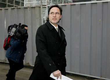 Marco Antonio Pinochet, son of former Gen. Augusto Pinochet, walks out of a court building where he presented a lawsuit against former intelligence chief Gen. Manuel Contreras, at a court in Santiago, Chile, Tuesday, July, 11, 2006. Pinochet announced he will present defamation charges against the retired general for making allegations published in a Chilean newspaper that his family enriched itself from drug trafficking. (AP Photo