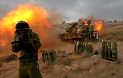 Israeli soldiers stand behind a mobile artillery piece firing from the Zaura area across the Lebanese frontier July 13, 2006. Israeli soldiers stand behind a mobile artillery piece firing from the Zaura area across the Lebanese frontier July 13, 2006.