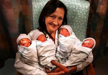 Director, Maternal-Fetal Medicine doctor Kathryn Shaw, holds the quadruplets, two boys and two girls, born to Angela Magdaleno, at the White Memorial Medical Center in Los Angeles, Wednesday, July 12, 2006. Doctor Shaw led the team that delivered the quadruplets on July 6. (AP Photo