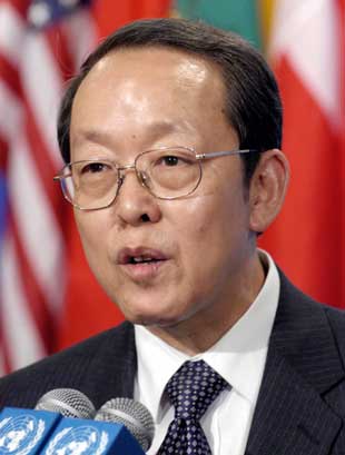 China's Ambassador to the United Nations Wang Guangya answers reporters' questions outside the Security Council chambers during consultations about the situation in North Korea at United Nations headquarters in New York July 14, 2006.