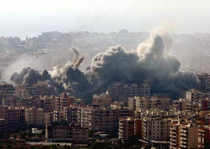 A large plume of smoke billows in the town of Khiam, in southern Lebanon, Tuesday, July 25, 2006, after Israeli air raids targeted it. An Israeli air raid on south Lebanon killed as many as four UN observers, overshadowing an international crisis meeting due to open in Rome, as Hezbollah vowed to fire rockets further into the heart of Israel.[AP Photo]