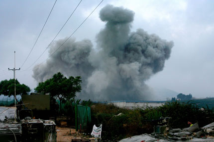 A Lebanese girl living in a camp for evacuees looks on at a school in the city of Zahle, about 55 km (34 miles) north of Beirut July 31, 2006. [Reuters]
