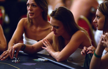 Players take part in the World Strip Poker Championship in London August 19, 2006. Up to 200 strip poker players competed on Saturday to see who will lose their shirts - and more - and who will scoop 10,000 pounds by retaining their clothes and modesty. [Reuters]
