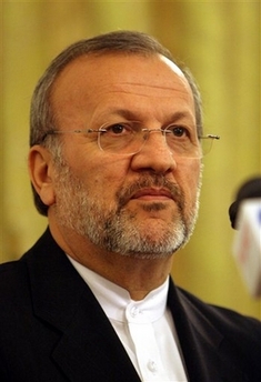 Iran's Foreign Minister Manoucher Mottaki attends a news conference in Tehran, Iran Wednesday Sept. 6, 2006. Mottaki said Wednesday that discussions were continuing to fix a date and venue for talks with the European Union over the disputed Iranian nuclear program. (AP