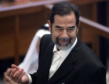 Former Iraqi president Saddam Hussein testifies as his trial resumes in the fortified Green Zone in Baghdad, Iraq Monday, Sept. 11, 2006. The second trial of Saddam Hussein, on charges of genocide in connection with a crackdown on Kurds, resumed Monday after a 19-day hiatus with the former Iraqi leader in the courtroom. Saddam and six co-defendants face a possible death penalty for the killings of tens of thousands of Kurds during the Anfal campaign, a massive military assault in northern Iraq in the 1980s. (AP