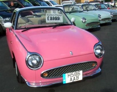A handout photograph released on September 26, 2006 shows a pink Nissan Figaro car at a car dealership near Worcestershire, England, which was inadvertently purchased on the ebay auction website by a three year old boy on his mother's computer.