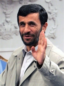Iranian President Mahmoud Ahmadinejad, waves to the media as he arrives for a meeting at his office in Tehran, Iran, Tuesday, Sept. 26, 2006. (AP Photo