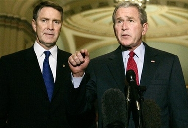President Bush, right, accompanied by Senate Majority Leader Bill Frist of Tenn. speaks to reporters on Capitol Hill in Washington, Thursday, Sept. 28, 2006 after meeting with the Senate Republican Conference. The president urged the Senate on follow the House's lead and approve a White House plan for detaining and interrogating terrorism suspects, saying, 'The American people need to know we're working together to win the war on terror.' (AP 
