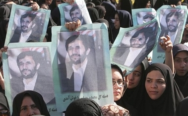 Iranian women hold posters of Iran's President Mahmoud Ahmadinejad during a public gathering in the city of Karaj, 21 miles (35 kilometers), west of the capital Tehran, Iran, Thursday, Sept. 28, 2006. Ahmadinejad on Thursday rejected demands that Tehran suspend its uranium enrichment activities, saying his government was determined to continue pursuing nuclear energy for peaceful purposes. (AP