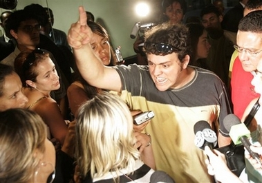 Relatives of passengers protest at the National Agency of Civil Aviation office, or ANAC , asking for more information of the Gol jet crash at the airport in Brasilia, Brazil, on Sunday, Oct 1, 2006. Search crews hunted Sunday through the wreckage of a Brazilian jetliner that crashed in the Amazon rain forest, though authorities said there was little chance any of the 155 people aboard had survived. The Boeing 737-800 apparently clipped a smaller executive jet which likely caused the crash Friday in jungle so dense that crews had to cut down trees Saturday to clear a space for rescue helicopters to land. (AP Photo