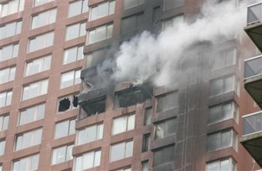 Reuters - Wed Oct 11, 4:33 PM ET Smoke billows out of the windows of a high-rise building after a small aircraft crashed into it in New York, October 11, 2006. 