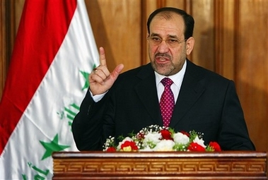 Iraqi Prime Minister Nouri al-Maliki, center, speaks to the media at a press conference Wednesday Oct. 25, 2006 in the fortified Green Zone in Baghdad, Iraq. U.S. and Iraqi forces on Wednesday raided Sadr City, the stronghold of the Shiite militia led by radical anti-American cleric Muqtada al-Sadr, but Prime Minister Nouri al-Maliki disavowed the operation, saying he had not been consulted and insisting 'that it will not be repeated.' The defiant al-Maliki also slammed the top U.S. military and diplomatic representatives in Iraq for their Tuesday news conference, at which they said Iraq needed to set a timetable to curb violence ravaging the country. (AP 