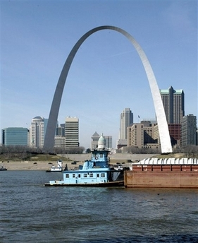 The St. Louis Gateway Arch is part of the St. Louis skyline as a barge and tow make their way north along the Mississippi River Wednesday, Feb. 18, 2004. Just days after the St. Louis Cardinals won the top honor in Major League Baseball, their hometown jumped to first place on a list no one wants to lead: the most dangerous cities in the United States. (AP