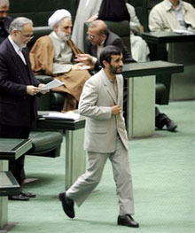 Iranian President Mahmoud Ahmadinejad makes his way to speak in an open session of parliament to debate his nominee as minister of Social Welfare in Tehran, Iran, Sunday, Oct. 29, 2006. Iran's parliament on Sunday approved Abdolreza Mesri as new minister of Social Welfare. In September Ahmadinejad applied the first change to his Cabinet after former social welfare minister, Parviz Kazemi resigned when a presidential evaluation committee confirmed that he failed to accomplish his mission over the past year. (AP