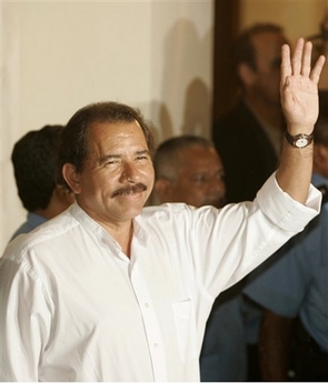 Nicaragua presidential candidate Daniel Ortega of the Sandinista National Liberation Front (FSLN) waves to the press as he arrives for a private meeting with former U.S. president Jimmy Carter in the city of Managua, Nicaragua on Monday Nov. 6, 2006. Electoral officials have yet to release final results from Sunday's vote, but preliminary results and two of the country's top electoral watchdog groups all give Ortega about 40 percent of the vote which could mean he will be rising once again to Nicaragua's presidency. (AP