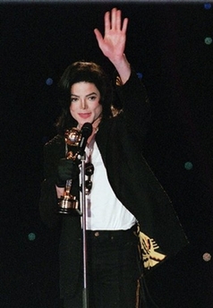 Michael Jackson waves after receiving his World Music Award for world's best-selling album of all time,'Thriller,' at the Monte Carlo Sporting Club, on May 8, 1996. Jackson received five World Music Awards at the ceremony. Jackson will perform 'Thriller' from his famed 1982 album in a rare public appearance at the World Music Awards in London next week, organizers of the awards said Wednesday, Nov. 8, 2006. (AP 