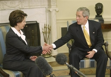 President Bush, right, shakes hands with Democratic House Leader Rep. Nancy Pelosi of Calif., during their meeting in the Oval Office of the White House in Washington, Thursday, Nov. 9, 2006. (AP