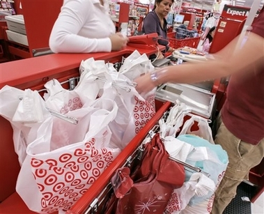 Shoppers check out at a newly-opened Target store near Royersford, Pa., on Monday, Nov. 13, 2006. Discount retailer Target Corp. said Tuesday its third-quarter profit rose 16 percent, beating analyst expectations as its sales rose 11 percent. (AP