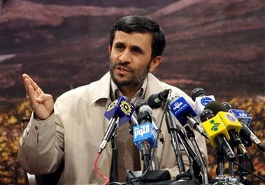Iranian President Mahmoud Ahmadinejad, speaks with to the media during a press conference in Tehran, Iran, Tuesday, Nov. 14, 2006. Ahmadinejad on Tuesday said Iran would soon celebrate completion of its controversial nuclear fuel program. (AP
