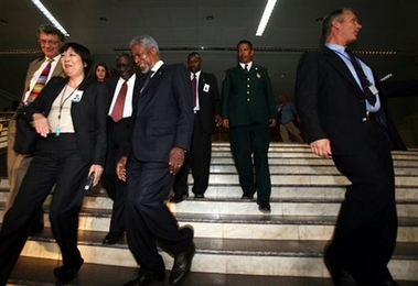 U.N. Secretary-General Kofi Annan, second from left, surrounded by aides and bodyguards leaves after the first half of a high level meeting on the war torn region of Darfur in the African Union Headquarters in the Ethiopian capital, Addis Ababa, Thursday, Nov. 16, 2006. African, Arab, European and U.N. leaders worked to break a deadlock over the worsening violence in Sudan's Darfur region on Thursday, trying to find ways to strengthen African Union peacekeepers, enforce a faltering cease-fire and reinvigorate peace talks. 