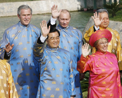 Leaders wearing traditional Vietnamese clothes known as the 