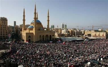 A general view of Lebanese protesters gathered during the funeral of prominent anti-Syrian Christian politician Pierre Gemayel, at the Martyrs square, in Beirut, Lebanon, Thursday Nov. 23, 2006. Hundreds of thousands of Lebanese gathered to bid farewell to an assassinated young Christian politician Thursday, and his anti-Syrian allies turned his funeral into a powerful show of force against their opponents, led by the militant Shiite Muslim Hezbollah and its Syrian backers. (AP 