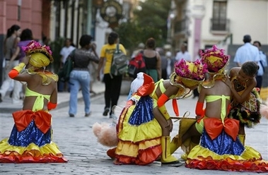 Tiny dancers of Guaracheritos de Regla get ready to perform during a cultural act at the San Geronimo College dedicated to Cuban leader Fidel Castro for his 80th birthday in Old Havana,Cuba, Tuesday, Nov. 28, 2006. Presidents, former leaders and Nobel laureates have confirmed their attendance at a five-day 80th birthday bash for ailing leader Fidel Castro. (AP