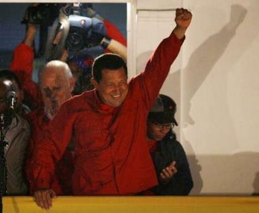 Venezuelan President Hugo Chavez greets hundreds of supporters from the balcony of the Miraflores Palace in Caracas December 3, 2006 after official election results gave him a victory by a wide margin. The anti-U.S. Venezuelan president claimed victory with a cry of 'long live the revolution' as official results showed him heading for a landslide re-election win on Sunday.