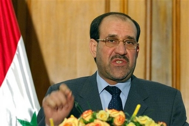 In this photo released by the Iraqi Prime Minister Press Office, Prime Minister Nouri al-Maliki holds a press conference in Baghdad, Iraq, Tuesday, Dec. 5, 2006. Prime Minister Nouri al-Maliki said Tuesday that his government will send envoys to neighboring countries to pave the way for a regional conference on ending the rampant violence in his country. (AP