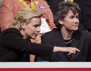 Mary Cheney, left, daughter of Vice President Dick Cheney, sits with her partner, Heather Poe, in Madison Square Garden during the Republican National Convention in New York in this Wednesday, Sept. 1, 2004 file photo. Mary Cheney is pregnant, according to a published report. Cheney, 37, and her partner of 15 years, Heather Poe, 45, are 'ecstatic' about the baby, due in late spring, The Washington Post reported in Wednesday's editions, quoting an unnamed source close to the couple. (AP