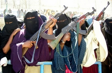 Veiled Somali women holding AK 47's in Mogadishu, Somalia, Monday, Dec 4, 2006. Hundreds of people demonstrated at Mogadishu Stadium in a protest against the U.S. proposed draft U.N. resolution on easing an arms embargo on Somalia. The angry demonstrators chanted anti-American slogans and carried banners and placards denouncing the U.S. proposals that could also allow regional peacekeeping troops to go to Somalia. (AP