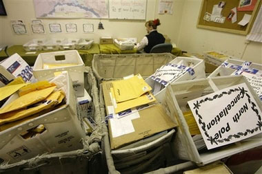 Marcia Bernier stamps the North Pole, Alaska cancellation on letters from Santa Claus at the main post office in Fairbanks, Tuesday Dec. 5, 2006. The Santa letters mailed to North Pole, Alaska, are processed in nearby Fairbanks. (AP Photo