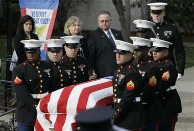 Kenneth and Pamela Schwarz, top center, parents of Marine Lance Cpl. Michael Schwarz watch Marine pall bearers carry his casket after funeral services in Carlstadt, N.J., Friday, Dec. 8, 2006. Schwarz, 20, of Carlstadt died Nov. 27, 2006, from wounds he sustained during combat in Iraq's Anbar province. He was a member of the 1st Battalion, 6th Marine Regiment at Camp Lejeune. (AP
