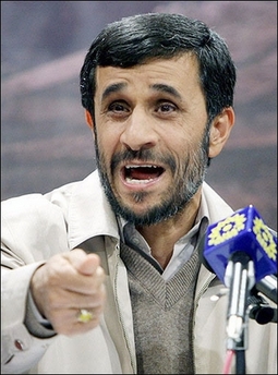 Iranian students staged a rare demonstration Monday against President Mahmoud Ahmadinejad, lighting a firecracker and burning his photograph as he delivered a speech at their university