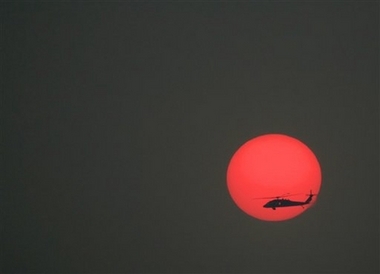 A U.S. military Black Hawk helicopter files over the heavily fortified Green Zone in Baghdad, Iraq, Wednesday, Dec. 13, 2006. For several months, U.S. and Iraqi officials have been discussing proposals to transfer responsibility of security in cities such as Baghdad from American forces to newly trained Iraqi police and soldiers. (AP 
