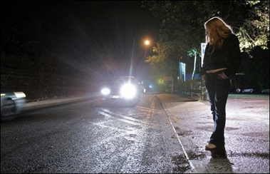 A prostitute stands on a nearly deserted street in Ipswich. One of the five prostitutes feared killed by a serial murderer in eastern England said she was afraid of going out on the streets days before she vanished, but said she needed the money, it has emerged.(AFP