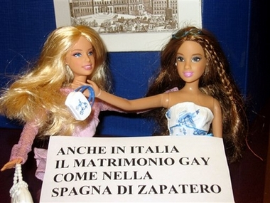 In this image made available by Italy's Radical Party website, two dolls with signs reading: 'Also in Italy gay marriages like in Zapatero's Spain' which were reportedly placed near the traditional nativity scene at the Italian parliament's Lower Chamber by two Radical party deputies, in Rome, Wednesday, Dec. 20, 2006, in a gesture intended as a show of support for a law that would give unmarried couples, including gays, some of the same rights as married couples. Two deputies with Italy's small but vocal Radical Party caused an uproar among appalled legislators in this predominantly Catholic country on Wednesday when they placed dolls representing two gay couples next to Parliament's nativity scene. (AP 