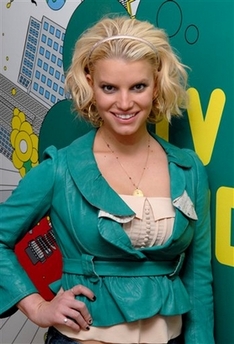 Jessica Simpson poses backstage at MTV's Times Square Studios, Oct. 4, 2006, in New York. Unhappy with her second try at paying tribute to Dolly Parton for the 'Kennedy Center Honors,' she requested that tape of her singing Parton's '9 to 5' be pulled from the show, which airs Dec. 26, 2006, on CBS.
