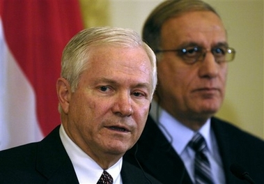 In this image released by the U.S. Department of Defense, U.S. Defense Secretary Robert Gates, front, attends a joint press conference with Iraq's Defense Minister Abdul-Qader al-Obaidi in Baghdad, Iraq, Thursday, Dec. 21, 2006. Gates, on his second day of a visit to Iraq, said he talked with the country's leaders about how the U.S. can best play a supporting role.