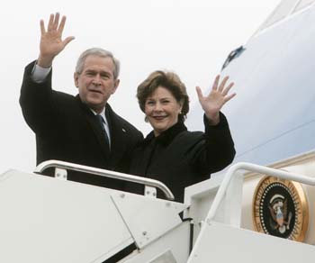U.S. President George W. Bush and first lady Laura Bush prepare to depart Andrews Air Force Base outside Washington for a week at their Central Texas ranch in Crawford December 26, 2006. 