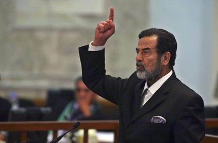 Former Iraqi President Saddam Hussein reacts to the verdict of his trial held under tight security in Baghdad's heavily fortified Green Zone November 5, 2006.