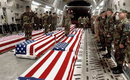 Coffins of U.S. military personnel are offloaded at Dover Air Force Base in Dover, Delaware in this undated file photo. The U.S. military death toll in Iraq has reached 3,000 on December 31, 2006, an unwelcome milestone for President George W. Bush who is searching for a way to turn around the unpopular war even if it means sending more troops. The Pentagon tightly restricts publication of photographs of coffins with the remains of U.S. troops and has forbidden journalists from taking pictures at Dover Air Force Base in Delaware, the first stop for the bodies of troops being sent home.