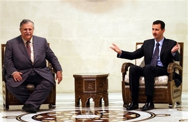 Syrian President Bashar Assad, right, meets his Iraqi counterpart Jalal Talabani on Sunday, Jan. 14, 2007 at Ash-Shaeb presidential palace in Damascus. Talabani flew in Damascus earlier in the day. His visit to Syria is the first by an Iraqi president in more than 26 years when the two countries cut diplomatic relations in 1980. Syria and Iraq resumed diplomatic relations last November. Talabani, a veteran Kurdish politician who had lived for years in exile in Syria, is expected to discuss with the Syrian officials security on the country's long desert border. The visit comes only days after U.S. President George W. Bush lashed out at Syria and its ally Iran, accusing them of supporting Iraqi insurgents, a charge which Damascus has repeatedly denied. (AP