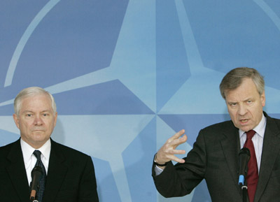 .S. Secretary of Defense Robert Gates (L) addresses a joint news conference with NATO Secretary-General Jaap de Hoop Scheffer at the Alliance headquarters in Brussels January 15, 2007. 