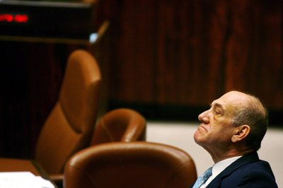 Israel's Prime Minister Ehud Olmert attends a session in the Knesset, the Israeli parliament, in Jerusalem January 17, 2007. The resignation of Israel's armed forces chief over failure to win last summer's Lebanon war dealt a fresh blow on Wednesday to Olmert, already weakened by political scandal. 