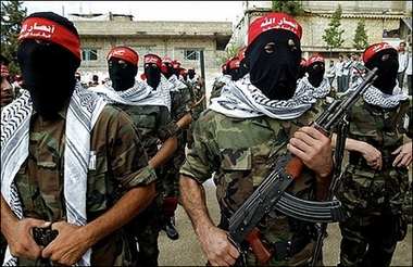 Hooded armed Palestinian militants from Ansarollah group take part in a military parade in Sidon, Lebanon, October 2006.