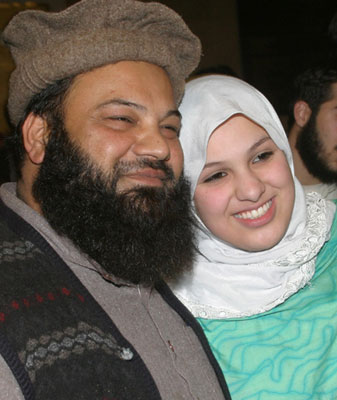 <b>Misbah Iram</b> Ahmed Rana (R), also known as Molly Campbell, hugs her father <b>...</b> - xin_380104191413125273462