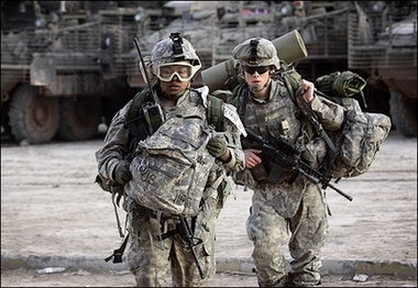 US soldiers from the 2-325 82nd Airborne Division move their equipment into a combat outpost set up in the restive Adhamiyah neighborhood of northern Baghdad. Iraqi and US troops fanned out across Baghdad as part of a long-awaited security plan to curb chronic bloodshed, but seven people died elsewhere in a US helicopter crash.(AFP/David Furst) 