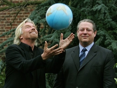 Sir Richard Branson , left, throws a globe into the air watched by former U.S. Vice President Al Gore, right, at a presentation to announce the Virgin Earth Challenge, in London, Friday Feb. 9, 2007.